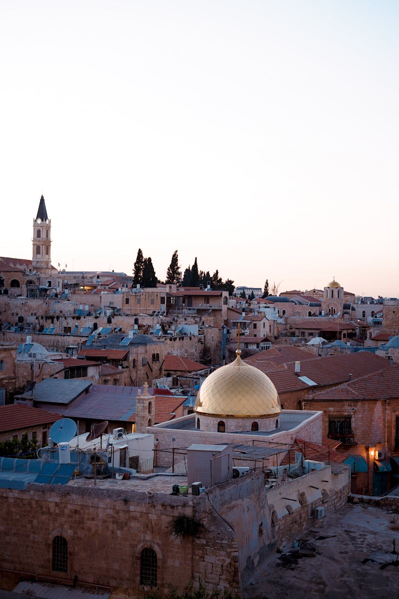 A stunning view over the historic city of Jerusalem with iconic architecture during golden hour.